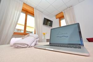 Postel nebo postele na pokoji v ubytování B&B Linae - Residence
