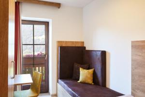 Postel nebo postele na pokoji v ubytování Hotel Sonnenheim
