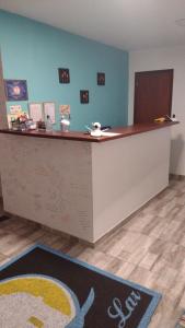 an office with a reception counter with a rug at MAR DOCE LAR in Cabo Frio