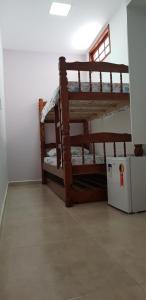 a room with two bunk beds in a room at MAR DOCE LAR in Cabo Frio