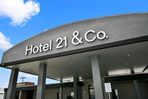 a hotel and co sign on a building at Hotel 21 in Gering