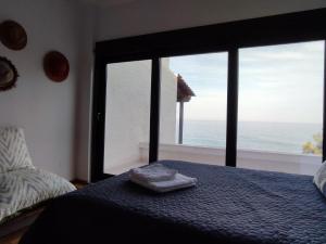 Ένα ή περισσότερα κρεβάτια σε δωμάτιο στο Beach House Emme