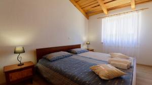 Postel nebo postele na pokoji v ubytování Holiday Home Gimino by Rent Istria