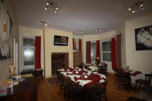 a living room with a table and chairs and a fireplace at Dolphins Hotel in Bournemouth