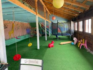 a room with swings and play equipment on the floor at Спортохота in Cherkasy