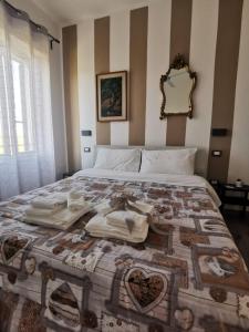 Postel nebo postele na pokoji v ubytování Castelvecchio B&B