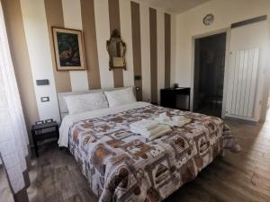 Postel nebo postele na pokoji v ubytování Castelvecchio B&B