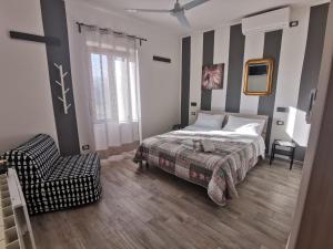 Postel nebo postele na pokoji v ubytování Castelvecchio B&B
