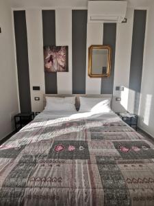 Postel nebo postele na pokoji v ubytování Castelvecchio B&B
