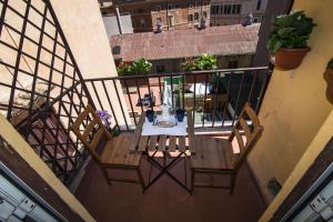 an overhead view of a table on a balcony at Tiberim Apartment Trastevere 9 in Rome