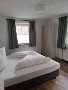 Postel nebo postele na pokoji v ubytování Appartement Schneeflöckchen