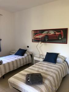 Un pat sau paturi într-o cameră la Armonie del Lago