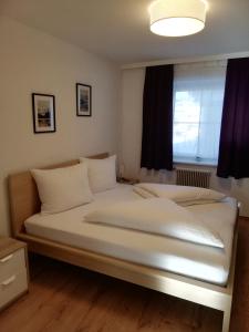Postel nebo postele na pokoji v ubytování Appartement Schneeflöckchen