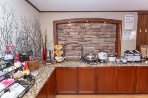 a kitchen with a counter with food on it at Staybridge Suites Bowling Green, an IHG Hotel in Bowling Green