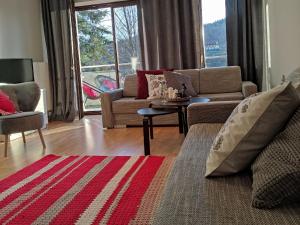 Area soggiorno di Apartamenty Czerwone Maki Wisła