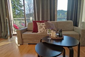 Area soggiorno di Apartamenty Czerwone Maki Wisła