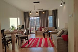 Area soggiorno di Apartamenty Czerwone Maki Wisła