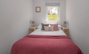 En eller flere senge i et værelse på Lily Bank House