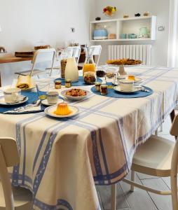 a table with plates of food on it at Casa Torrese in Torre del Greco