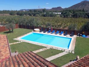 a swimming pool in the yard of a house at Villa Erilia in San Giovanni Suèrgiu