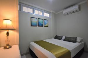 Postel nebo postele na pokoji v ubytování Nest Residence + 18 fotografií