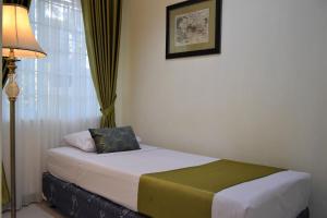Uma cama ou camas num quarto em Nest Residence