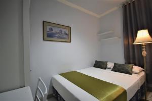 Uma cama ou camas num quarto em Nest Residence