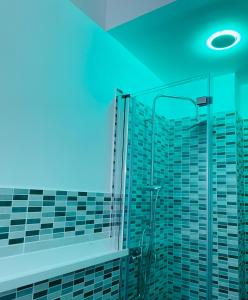a bathroom with a shower with a view of buildings at Casa Torrese in Torre del Greco +38 photos