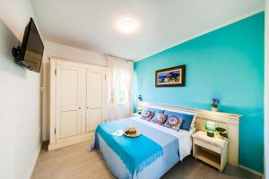 A bed or beds in a room at Casa al mare con parcheggio privato