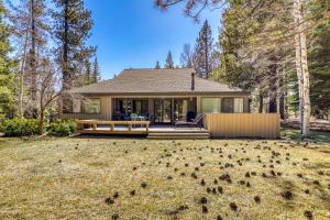 a house with a large yard in front of it at 3 Summit View in Sunriver