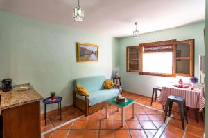 a living room with a couch and a table at tuGuest Aljibe del Rey Apartment in Granada