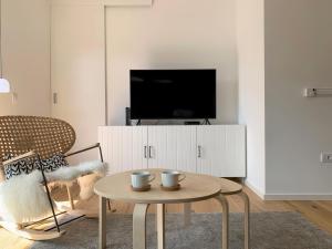 Televízia a/alebo spoločenská miestnosť v ubytovaní Apartment View