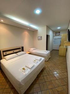 Lova arba lovos apgyvendinimo įstaigoje Hotel Tropeiro da Lapa