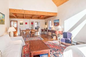 a living room with a couch and a table at Colorado East 735 - Idlewood East in Telluride