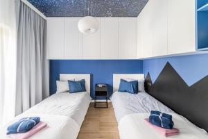 Posteľ alebo postele v izbe v ubytovaní Apartament Nad Potokiem Skrzyczne Residence