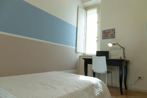 A bed or beds in a room at Zara D'Amare a Pesaro 10 metri dalla spiaggia by Yohome