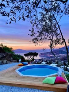 a pool in a backyard with a view of the city at Villa dei Golfi in SantʼAgata sui Due Golfi