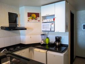 Kitchen o kitchenette sa Aconchegante Apartamento com Vista para o Mar e Nascer do Sol