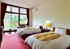 Letto o letti in una camera di 筋肉と自然と遊ぶ宿 田島館