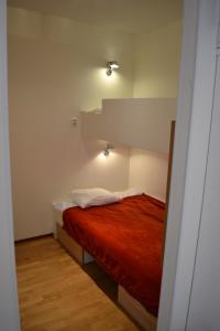 En eller flere senge i et værelse på Ylläs Chalets A9206