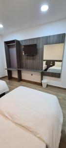 Postel nebo postele na pokoji v ubytování Zitro Hotel
