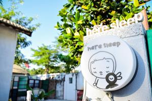 Certificato, attestato, insegna o altro documento esposto da Here Sleep Guesthouse
