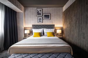 Postel nebo postele na pokoji v ubytování Hotel Osijek