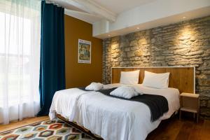 Postel nebo postele na pokoji v ubytování Johan Design & SPA Hotel