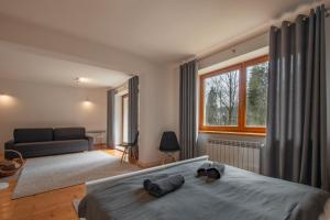 Postel nebo postele na pokoji v ubytování Apartamenty nad Potokiem