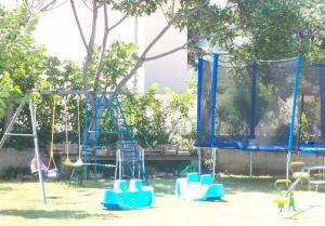 a playground with swings and a swing set at Apartment in Lopar with Balcony, Air condition, WIFI (4224-3) in Lopar
