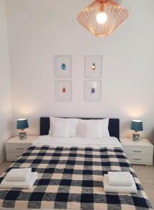 Łóżko lub łóżka w pokoju w obiekcie Apartamenty Jantar