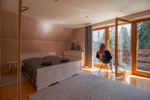 Postel nebo postele na pokoji v ubytování Apartamenty nad Potokiem