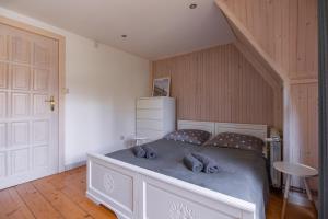 Postel nebo postele na pokoji v ubytování Apartamenty nad Potokiem