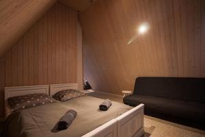 Postel nebo postele na pokoji v ubytování Apartamenty nad Potokiem
